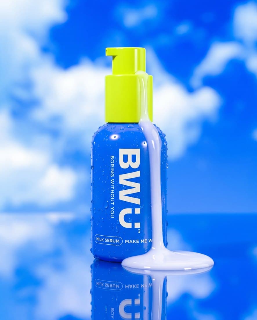 Skincare tube hero on bold color-blocked set, high-key studio lighting